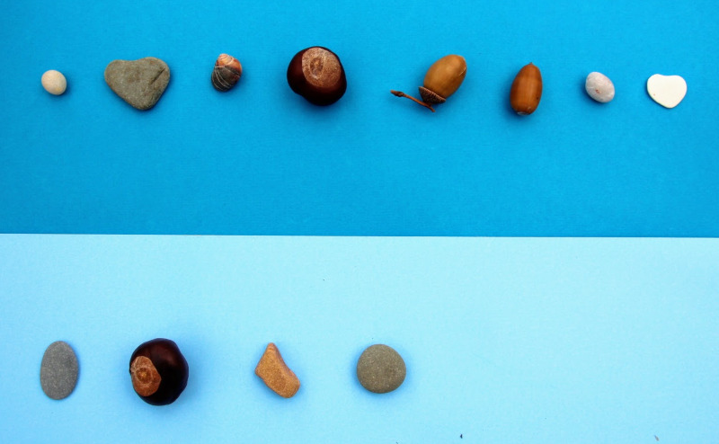 pebbles, conkers, acorns making a sequence of shape pattern